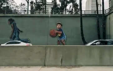 mural of child holding a basketball
