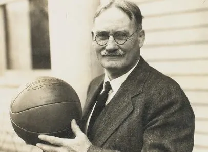 James Naismith holding a basketball