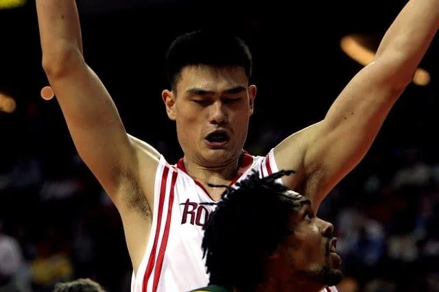 Yao Ming playing defense for the Houston Rockets.