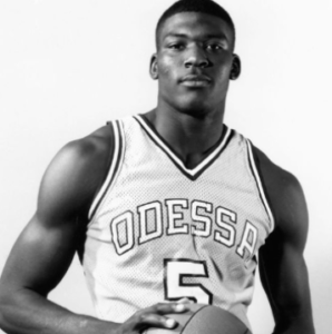 larry johnson at Odessa College in jersey holding basketball